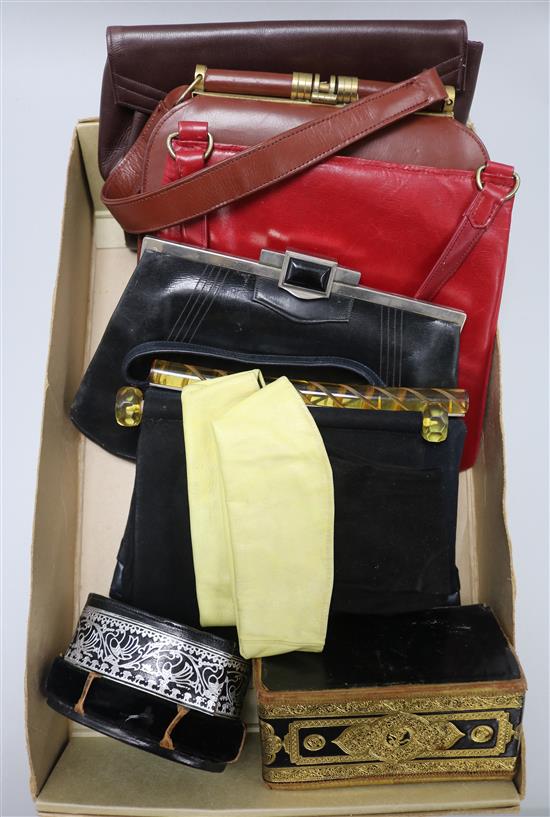 A pair of black and yellow leather gauntlets and a collection of Bakelite handed and other handbags